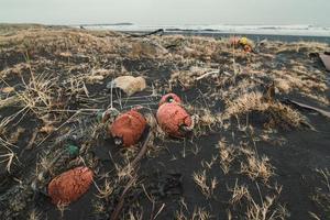 Close up old fishing net with buoy on beach concept photo