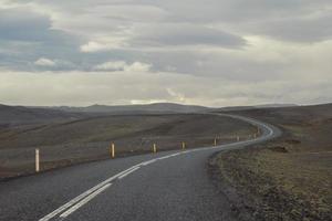 Empty road across hills landscape photo