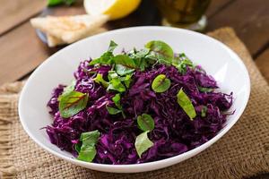 Salad of red cabbage with herbs photo