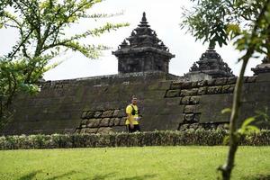 Yogyakarta, Indonesia - November 20, 2022 The Sleman Temple Run contingent passed the scenic route of the Barong temple, they took part in a trail running contest. photo