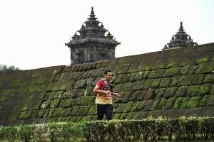 Yogyakarta, Indonesia - November 20, 2022 The Sleman Temple Run contingent passed the scenic route of the Barong temple, they took part in a trail running contest. photo