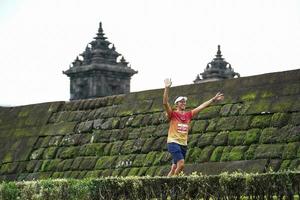 Yogyakarta, Indonesia - November 20, 2022 The Sleman Temple Run contingent passed the scenic route of the Barong temple, they took part in a trail running contest. photo