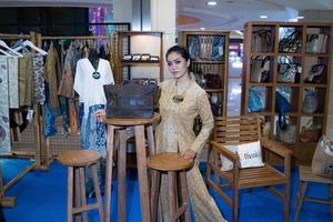 Yogyakarta, Indonesia - December 03, 2022  stylish female models among micro, small and medium enterprises, showing attractive clothes, accessories and properties. photo