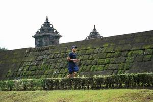 Yogyakarta, Indonesia - November 20, 2022 The Sleman Temple Run contingent passed the scenic route of the Barong temple, they took part in a trail running contest. photo