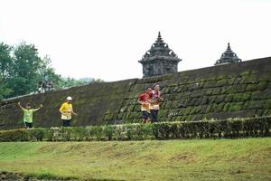 Yogyakarta, Indonesia - November 20, 2022 The Sleman Temple Run contingent passed the scenic route of the Barong temple, they took part in a trail running contest. photo