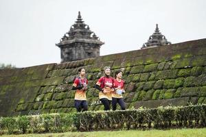 Yogyakarta, Indonesia - November 20, 2022 The Sleman Temple Run contingent passed the scenic route of the Barong temple, they took part in a trail running contest. photo