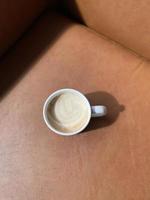 Hot coffee cup on table photo