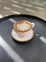 Hot coffee cup on table photo