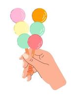 Sweet colorful dango in hand. Japanese sweets. vector