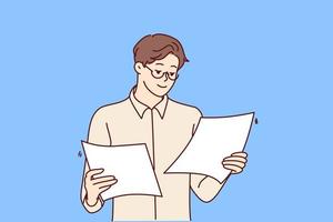 Concentrated man holding two sheets of paper in hands reading report for company management. Successful guy office worker in white shirt is standing studying documentation. Flat vector design