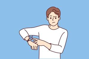 Angry young man point at wristwatch warn about deadline. Mad male notify about missing time showing on clock on wrist. Vector illustration.