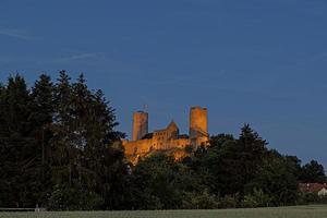 Image of illuminated Muenzenberg castle ruin in Germany in the evening photo