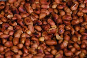 Close up roasted peanuts background, top view, food background. photo