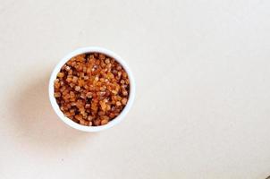 Top view bowl of Crystal Sugar with Copy space, Brown cane sugar, caramel sugar photo