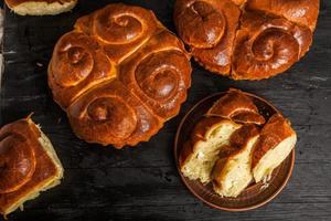 Fresh bread from the oven. Traditional cheese pie from Romania called Saralie. Homemade bread made from white wheat flour. photo