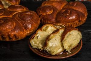 Fresh bread from the oven. Traditional cheese pie from Romania called Saralie. Homemade bread made from white wheat flour. photo