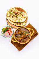 Indian style Mutton OR Gosht Masala OR indian lamb meat rogan josh served with Naan photo