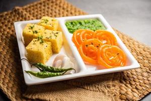 Khaman Dhokla with Jalebi or imarti, popular snack combination from India photo