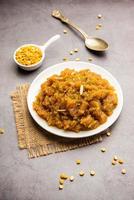 Besan Halwa, shira, sheera is a rich dessert made with gram flour, ghee and sugar photo