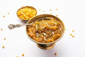 Besan Halwa, shira, sheera is a rich dessert made with gram flour, ghee and sugar photo