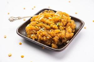 Besan Halwa, shira, sheera is a rich dessert made with gram flour, ghee and sugar photo