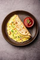 Omelette chapati roll or Franky. Indian Popular, quick healthy recipe for kid's tiffin or lunch box photo