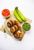 Raw Banana Cutlet also called plantain or kacche kele ki tikki or patties, served with chutney photo