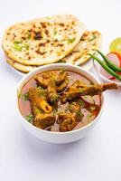 Indian style Mutton OR Gosht Masala OR indian lamb meat rogan josh served with Naan photo