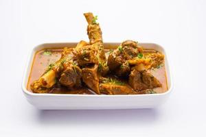 Indian style Mutton OR Gosht Masala OR indian lamb meat rogan josh served with Naan photo
