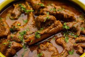 Indian style Mutton OR Gosht Masala OR indian lamb meat rogan josh served with Naan photo