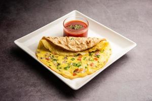 Omelette chapati roll or Franky. Indian Popular, quick healthy recipe for kid's tiffin or lunch box photo
