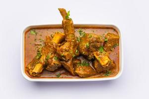 Indian style Mutton OR Gosht Masala OR indian lamb meat rogan josh served with Naan photo