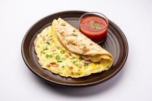 Omelette chapati roll or Franky. Indian Popular, quick healthy recipe for kid's tiffin or lunch box photo