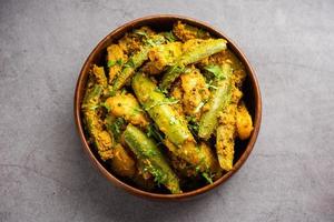 Aloo Potol or Dalna Recipe is a traditional sabzi from bengal made with potato and pointed gourd photo