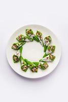 Kaju Gulkand Paan Mithai barfi - Indian sweet or dessert served in a plate photo