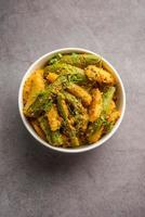 Aloo Potol or Dalna Recipe is a traditional sabzi from bengal made with potato and pointed gourd photo