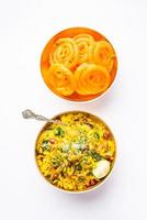 Aloo Poha with Jalebi, snack combination also called imarti and kande pohe photo