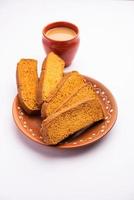 Crispy cake rusk or Delhi toast with masala tea photo