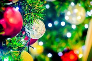 Background for Christmas season. Close-up shot of a beautiful decorated fir tree. photo