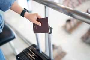 Close up of passport and boarding pass at indoor airport photo