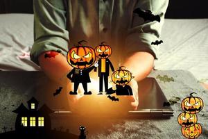 Relaxing day at home with Halloween cartoons Devil's Pumpkin  Concept Halloween festival and house activities photo