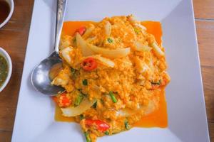 Stir-fried crab meat with curry powder, Thai food. photo