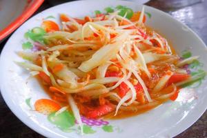 papaya salad with sour, sweet, spicy and crispy taste from grated papaya. photo