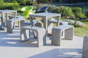 Tables and chairs made of cement. photo