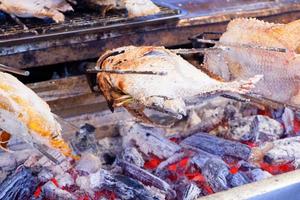 Big tilapia, salted and burnt. street food in thailand. photo