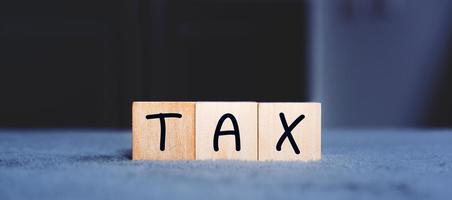 Concept of taxes paid by individuals and corporations such as VAT, income tax and property tax Data analysis, paperwork,Financial research,TAX on block cubes.