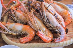 Grilled Big River Prawn Placed on a bamboo plate. photo