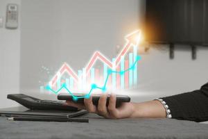 Concept stock return investment technology. business growth plan with virtual hologram chart Calculate earnings and capital gains and increase in positive growth indicators. photo