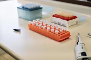 Top view of pipette and test tubes in a laboratory. photo