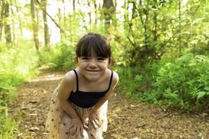 Cute girl smiles looking at the camera. photo